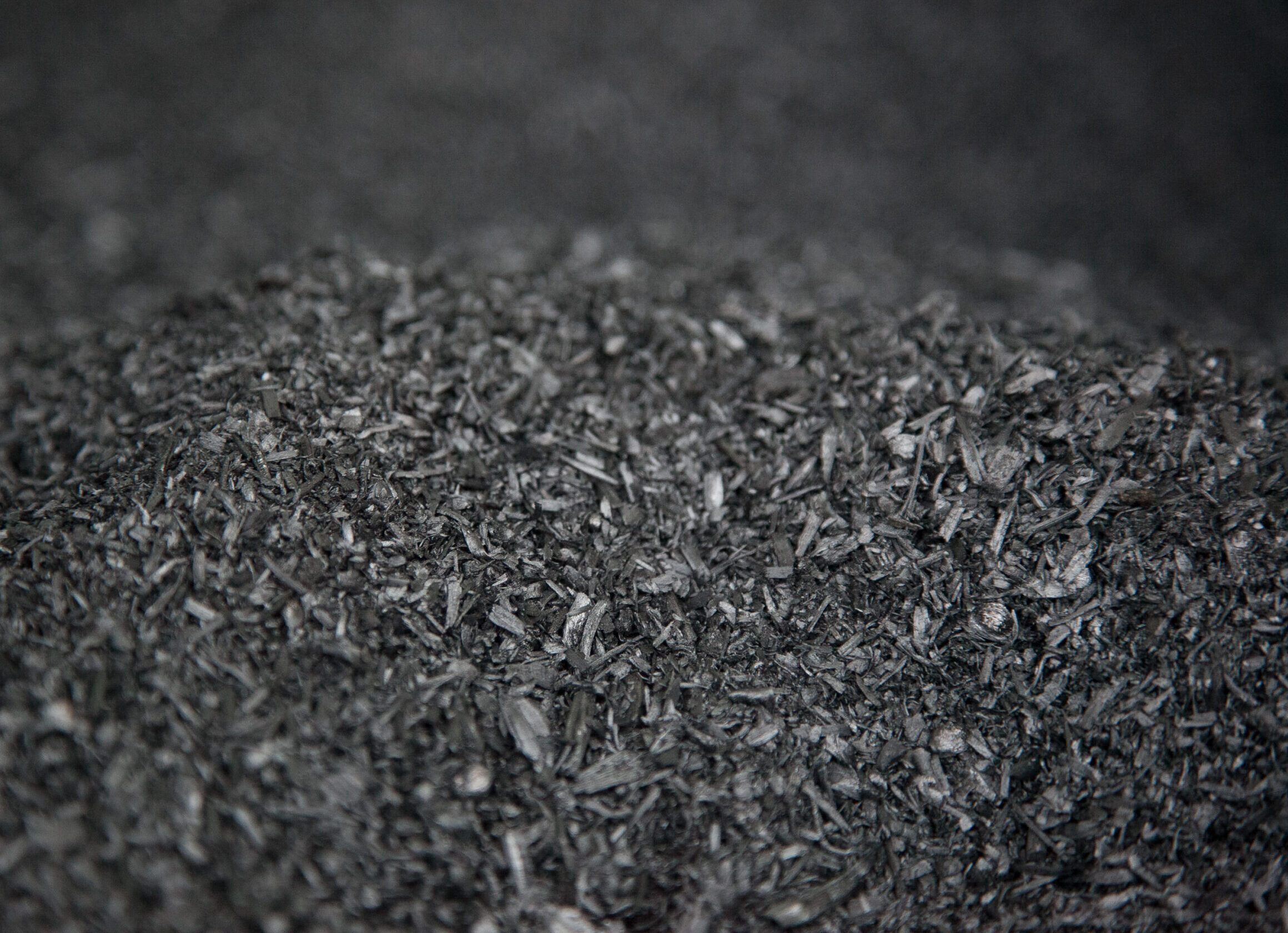 biochar pile scaled e1774417441830.jpg